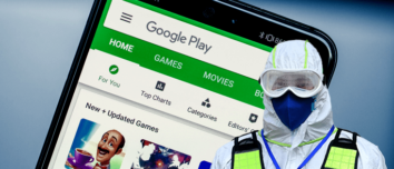 Chinese authority in a protective coverall in front of a smartphone with Google Play Store loaded.
