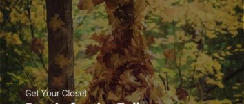 A woman depicting autumn fashion trends, wearing a dress covered in fall leaves.