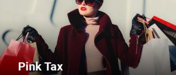 Woman with a pink turtleneck shirt, red overcoat, and multiple shopping paper bags.