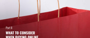Red paper shopping bag with handles.